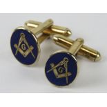 Masonic; a pair of blue enamelled cufflinks having square and compass design upon.