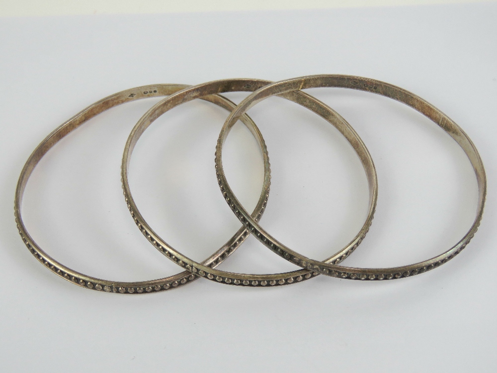 A set of three HM silver bangles, each h