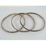 A set of three HM silver bangles, each h
