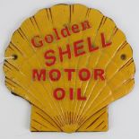 A cast metal wall plaque, 'Golden Shell