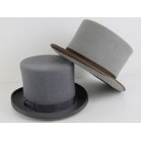 Two grey felt top hats; one hand made by