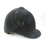 A velvet covered peak riding hat as made by Lock & Co London, size 7 1/4.