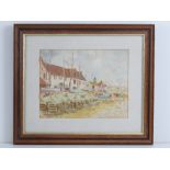 Watercolour; seaside scene Burnham Overy, Norfolk, fishing boats on grassy verge, houses beyond,