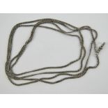 A long white metal guard chain having clasp to one end, 78.5cm in length, 37.9g.