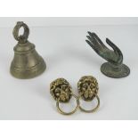 A wall mounted burnished copper key holder in the form of an outstretched hand,