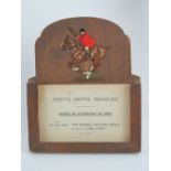 A 1930's easel hunting meet card stand having pierced and coloured mounted huntsman in full cry