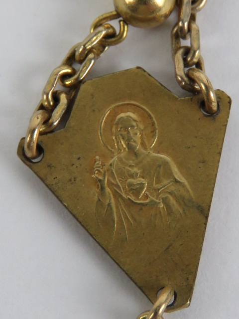 A gilt metal rosary having crucifix upon marked France. - Image 4 of 4