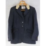 A Bernard Weatherill navy ladies hunting jacket with plastic Pychley HUnt buttons upon,