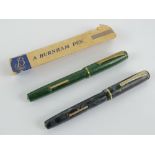 A vintage 'self-filling' fountain pen by Burnham having 14ct gold nib and sleeve,