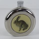 A circular spirit flask having the image of a seated Hare upon, 10.5cm high.