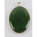 A large green agate pendant in setting stamped 925, 5cm inc bale.