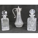 Two heavy cut glass square shaped decanters with matching stoppers,