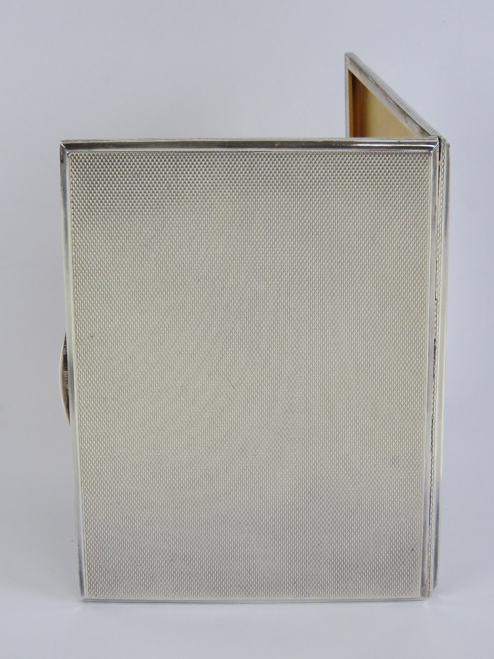 A hallmark silver cigarette case having engine turned engraved pattern throughout, gilt interior, - Image 3 of 4