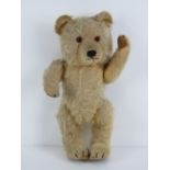 Looking for a new home - A vintage mohair fully jointed Teddy bear having internal musical chime,