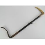 A HM silver collared and malacca horn handles riding crop with short leather tail, 67cm in length,