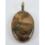 A large hardstone pendant in setting stamped 925, 7cm inc bale.