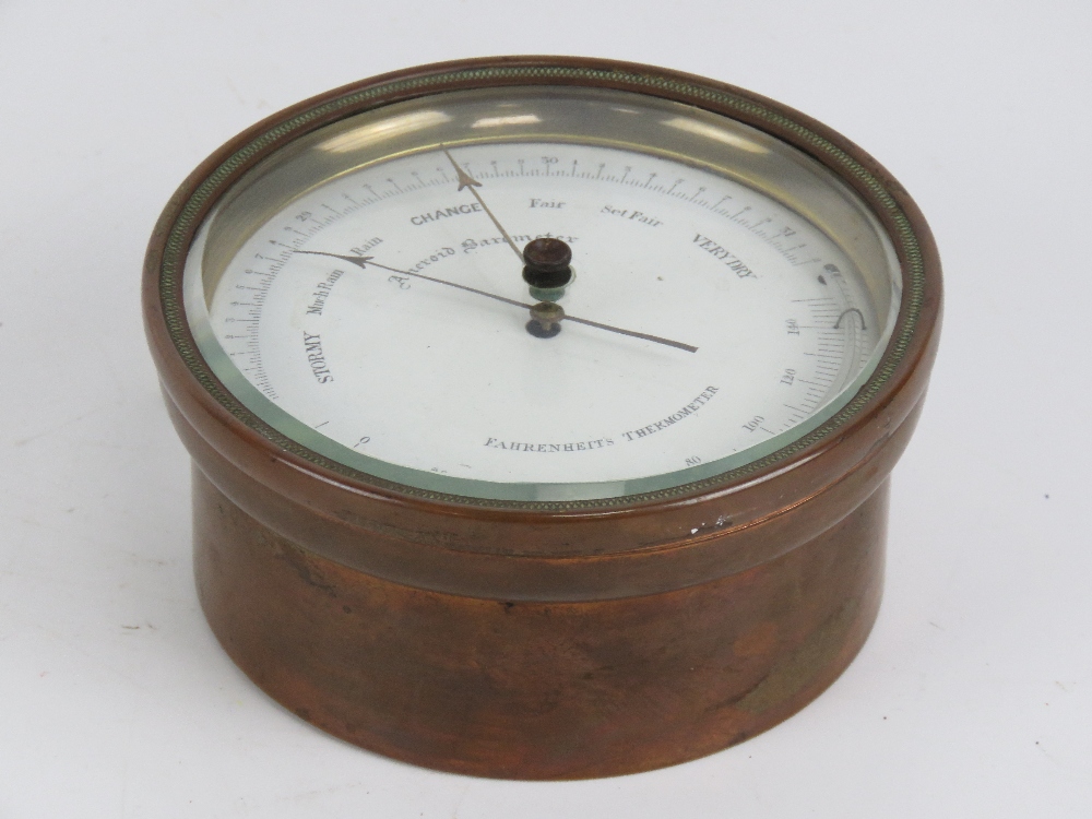 A copper cased Farenheight thermometer and aneroid barometer, wall hanging, 12cm dia. - Image 2 of 3