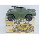 An original Action Palitoy Scout car in original box, with centre mounted machine gun,