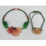 Two c1940s lucite necklaces, one of a partially opened rosebud with leaves behind, 5.