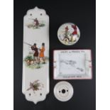 A ceramic door handle having shooting theme upon together with matching ceramic door plate.