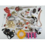 A quantity of assorted costume jewellery including a white stone cocktail bracelet by Monet,