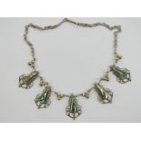 A silver and abalone shell necklace having filigree and floral panels, 43.5cm in length.