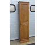 A single door pine cupboard.
