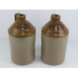 A pair of salt glazed stoneware one gallon jugs having printed marks upon for Duckworth & Co Ltd