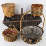 A wickerwork semi hemispherical trug, together with three wicker and straw work baskets. Four items.