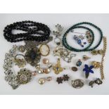 A quantity of assorted vintage costume jewellery including french jet bead necklace,