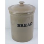 A glazed Stoneware bread bin with lid standing 37cm high.