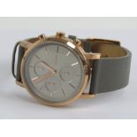 DKNY; a 'rose gold' stainless steel wristwatch having grey dial and leather strap, 11504 NY-2338,