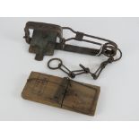 A vintage mole trap complete with tethering chain, together with a vintage rat trap 'The Nipper'.