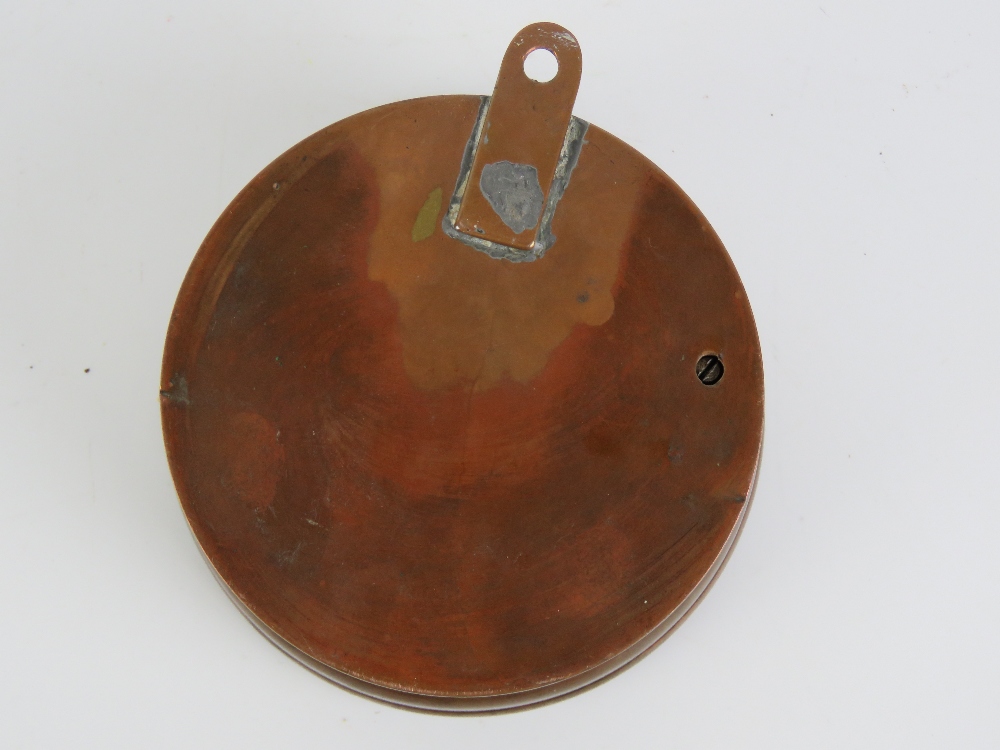 A copper cased Farenheight thermometer and aneroid barometer, wall hanging, 12cm dia. - Image 3 of 3