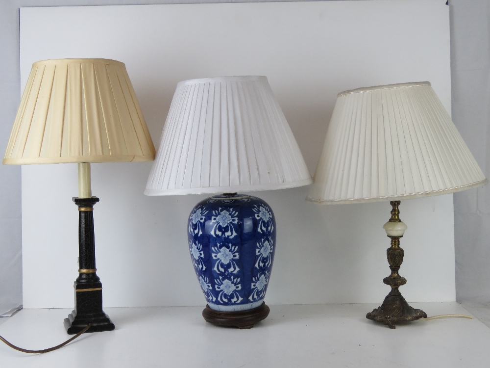 Three table lamp bases, one brass and onyx,