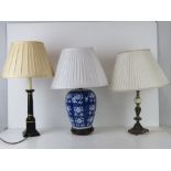Three table lamp bases, one brass and onyx,