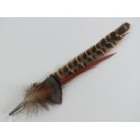 A vintage feathered hat pin or brooch 23cm in length.