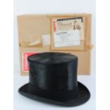 A silk top hat by S Patey London, size 7 1/4,