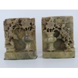 A pair of Oriental carved and pierced soapstone bookends, each standing 15cm high, slightly a/f.