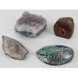 Three geodes together with an abalone shell. Four items.