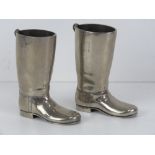 A pair of silver plated 1.5oz tot cups in the form of riding boots.