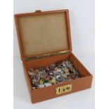 A vintage pigskin leather travelling jewellery case having London made brass lock and containing a