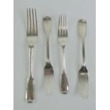 A single HM silver dinner fork with matching salad forks,