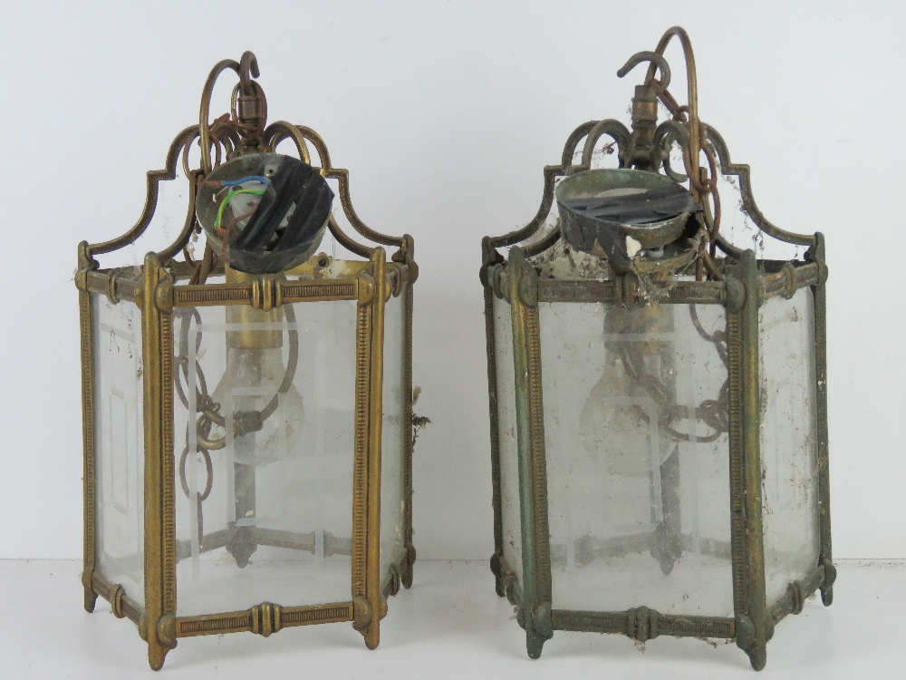 A matched pair of brass and glass pentagonal hall lanterns, each wired for electricity, 32cm high.