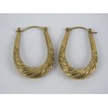 A pair of 9ct gold large oval hoop earrings, stamped 375, 1.9g.