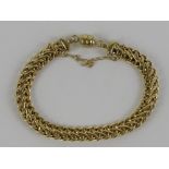 A 9ct gold articulated fancy link chain bracelet having magnetic clasp for easy fastening,