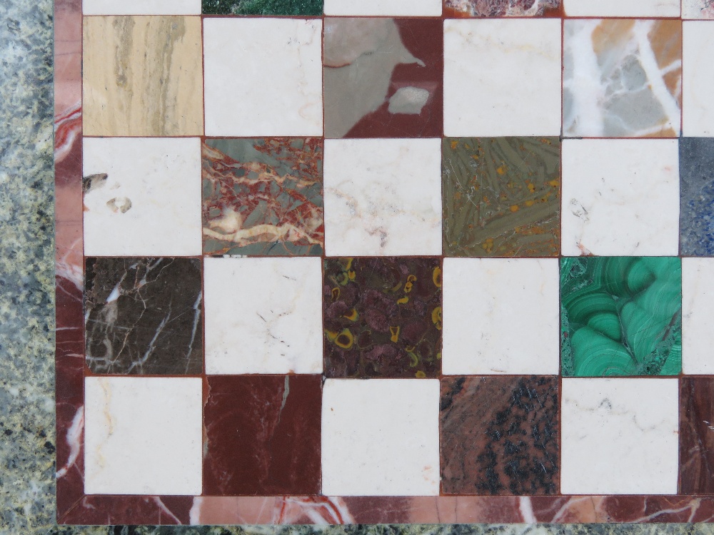 A circular Pietra Dura tabletop having inlaid marble and hardstone specimens in the form of a chess - Image 5 of 5