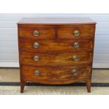 A late Georgian bow fronted chest of two short over three long drawers,