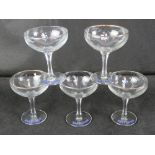 A set of five Babycham champagne saucers.