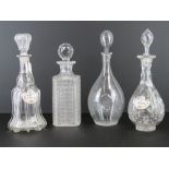 Four assorted cut glass decanters together with two ceramic labels for Port and Sherry.